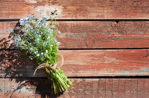 bouquet of forget-me-nots on a wooden background