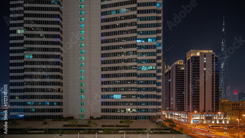 Aerial panoramic view to Dubai downtown skyscrapers night timelapse.