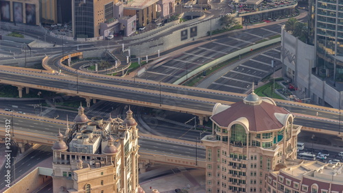 Bussy traffic on the overpass intersection in Dubai downtown aerial timelapse. © neiezhmakov
