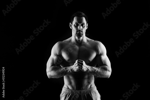 Muscular and sexy torso of young man having perfect abs, bicep and chest. Male hunk with athletic body. Fitness concept © sergiophoto