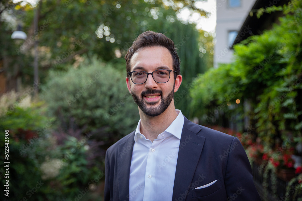 Portrait of a smiling caucasian businessman in elegant suit outdoors. Portrait of a smiling caucasian businessman in elegant suit outdoors.