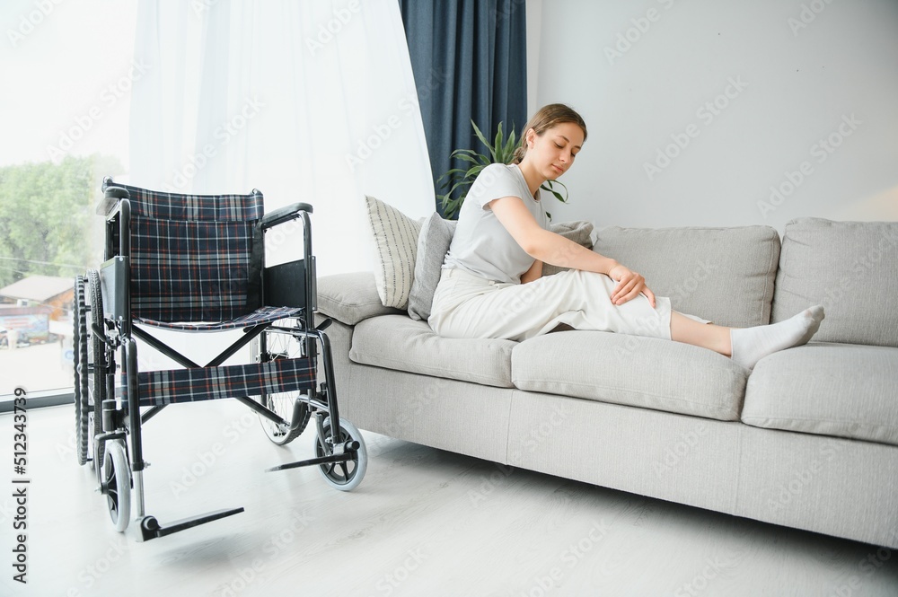 woman trying to sit down in wheelchair from couch woman trying to sit down in wheelchair from couch
