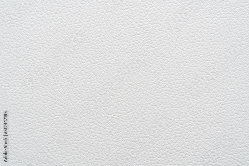 White natural leather with grainy texture for background.