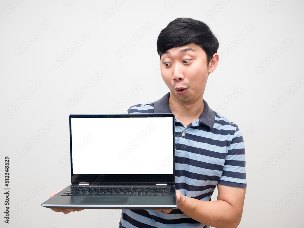 Man striped shirt excited emotion looking at laptop white screen Man striped shirt excited emotion looking at laptop white screen