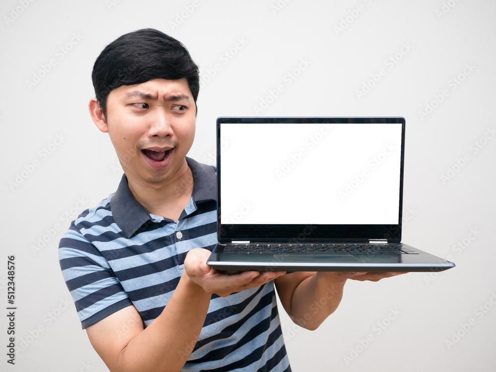 Portrait man striped shirt excited emotion looking at laptop white screen Portrait man striped shirt excited emotion looking at laptop white screen