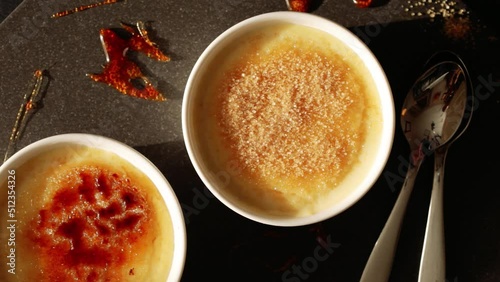 Caramelizing Creme brulee. French dessert.