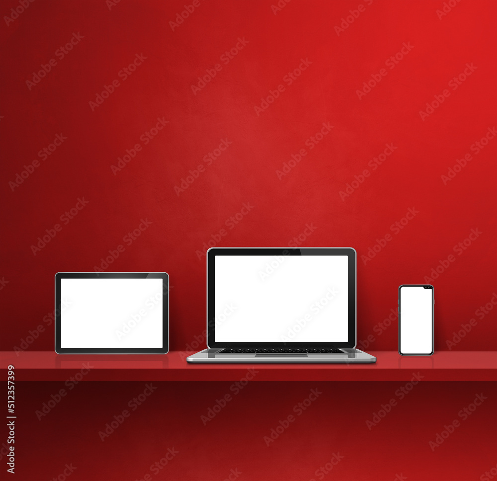 Laptop, mobile phone and digital tablet pc on red wall shelf. Square background Laptop, mobile phone and digital tablet pc on red wall shelf. Square background