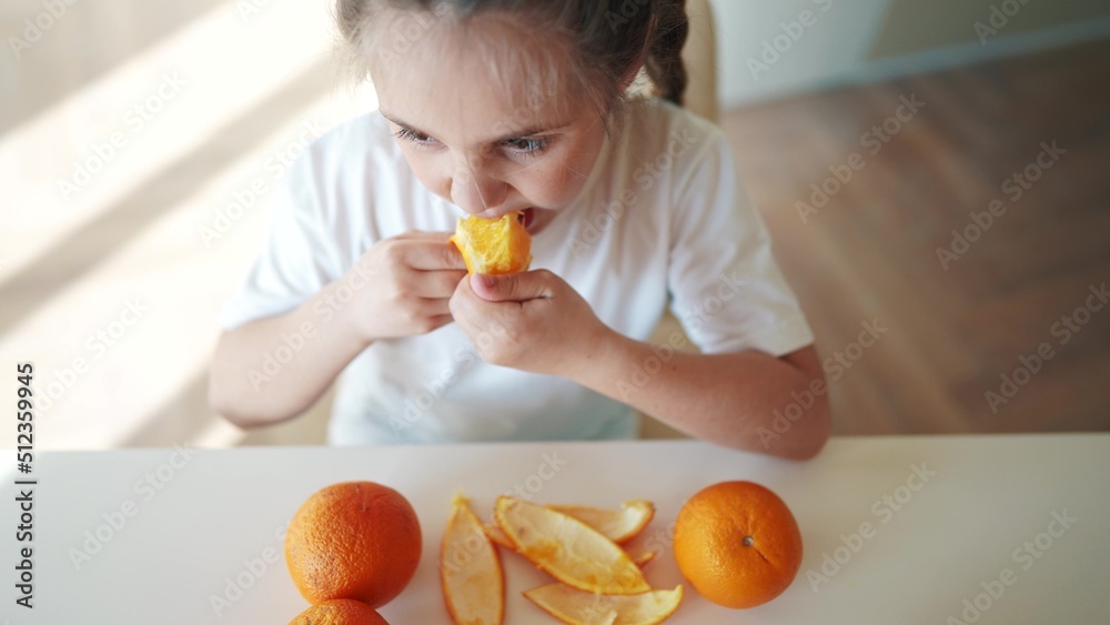girl child eating oranges. dream happy family fruit healthy food kid