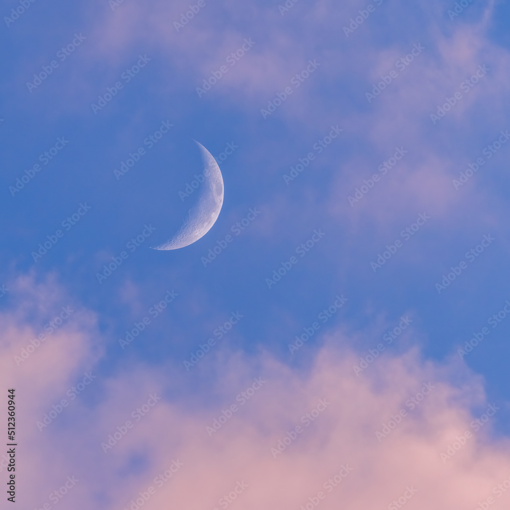 Sunset sky with large crescent moon, evening sky background Sunset sky with large crescent moon, evening sky background