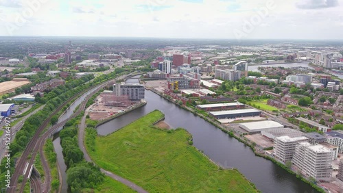 Manchester, UK: Aerial view of city in England, suburb with greenery and river Irwell - landscape panorama of United Kingdom from above photo