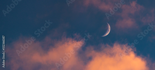 Sunset sky with large crescent moon, evening sky background photo