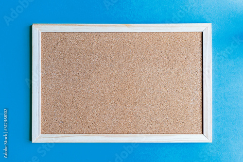 A cork board is a framed section of cork backed with wood or plastic. Typically, it is used as a bulletin board, because the resilient nature of cork makes it ideal for sticking pins and tacks into.	