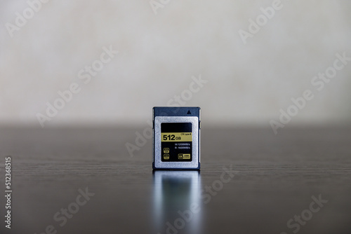 CFexpress memory card on dark table photo