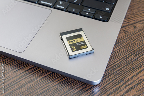 CFexpress memory card lies on a laptop