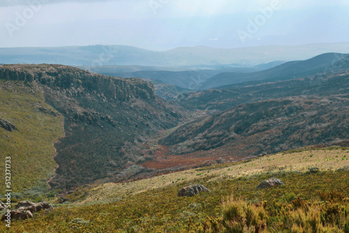 Scenic view of rock formations against a mountain background at Ol Doinyo Lesatima Dragons Teeth in the Aberdares, Kenya