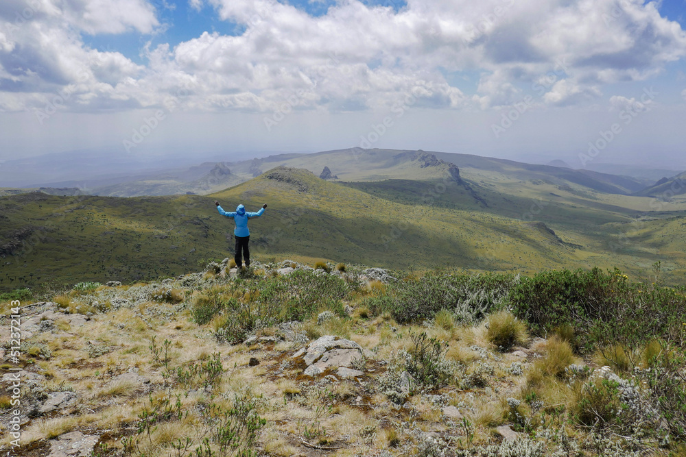 View of a man against mountains at Ol Doinyo Lestima Dragons Teeth in the Aberdares, Kenya