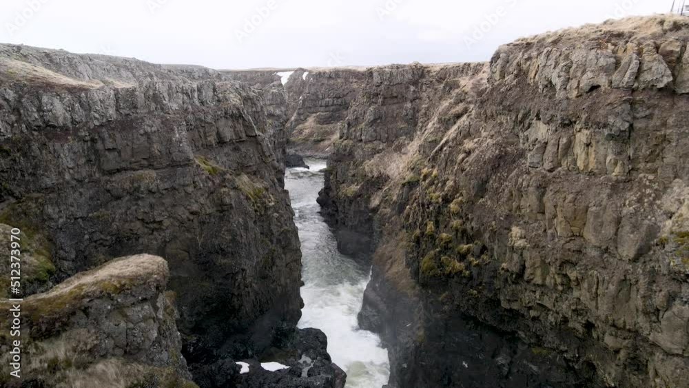 Kolugljufur Canyon with a waterfall in North Iceland Kolugljufur Canyon with a waterfall in North Iceland