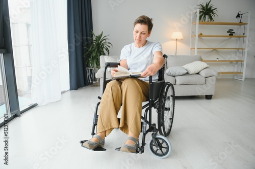 middle aged woman sitting on wheelchair
