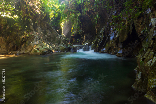 the beauty of the tropical forest with a waterfall in the morning © RahmadHimawan