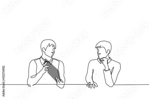 men at table next to one shows screen of tablet to other he looks and listens propping chin with his hand - one line drawing vector. concept presentation of project or work to boss, customer, expert