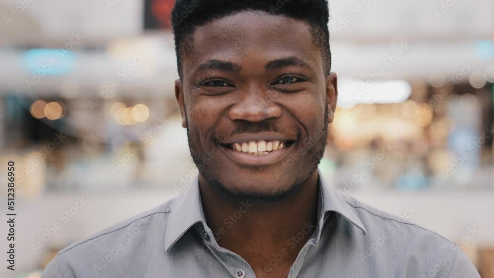 Male portrait close-up young surprised amazed african american man feeling shock surprise happy guy smiling nodding answers yes positive answer great decision choice agree expresses approval good idea Male portrait close-up young surprised amazed african american man feeling shock surprise happy guy smiling nodding answers yes positive answer great decision choice agree expresses approval good idea