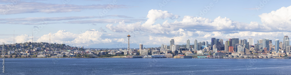 Downtown Seattle, Washington, United States of America. Panoramic View of the Modern City on the Pacific Ocean Coast. Cloudy Blue Sky.