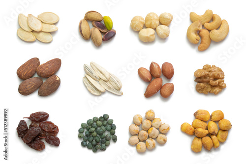 Assorted nuts sets on isolated white background. Pumpkin seeds, pistachios, hazelnuts, cashews, almonds, sunflower seeds, peanuts, walnuts, raisins, terebinth berry, roasted chickpea, corn with sauce.