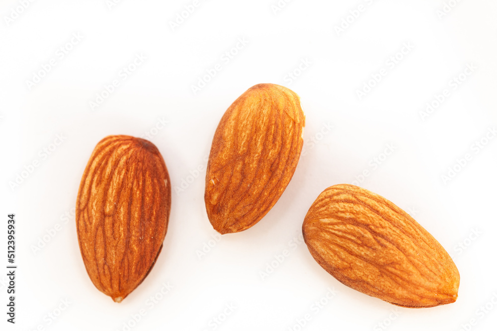 Close-up of natural big raw peeled almonds nuts as a background Close-up of natural big raw peeled almonds nuts as a background
