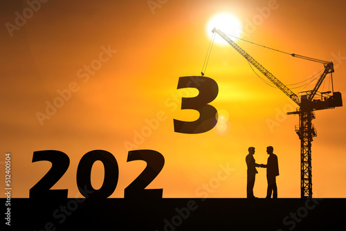 Happy New Year 2023 concept. Businessmen join hands. Successful in contacting work