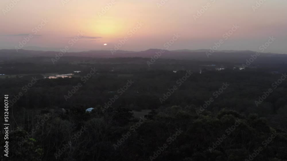 Aerial sideways right to left view at sunset of Noosa Heads from mount Tinbeerwah in Queensland, Australia Aerial sideways right to left view at sunset of Noosa Heads from mount Tinbeerwah in Queensland, Australia