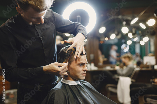 Stylish man sitting in a barbershop