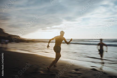 person running on the beach, to take a bath