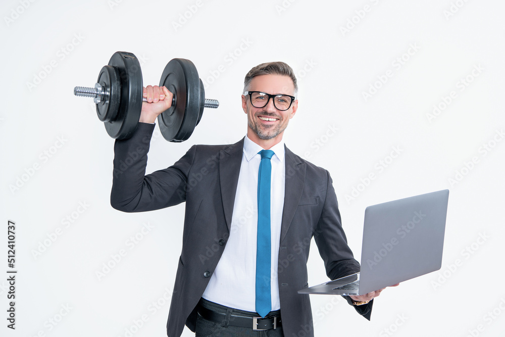 glad businessman in suit hold heavy dumbbell and laptop isolated on white background glad businessman in suit hold heavy dumbbell and laptop isolated on white background
