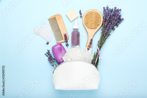natural cosmetics on a blue background with lavender. top view