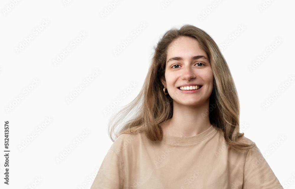 Smiling young woman looking at camera, isolated on white background. Beautiful student closeup portrait. Joyful caucasian girl laughing, beauty, success, lifestyle people, emotions, concept Smiling young woman looking at camera, isolated on white background. Beautiful student closeup portrait. Joyful caucasian girl laughing, beauty, success, lifestyle people, emotions, concept