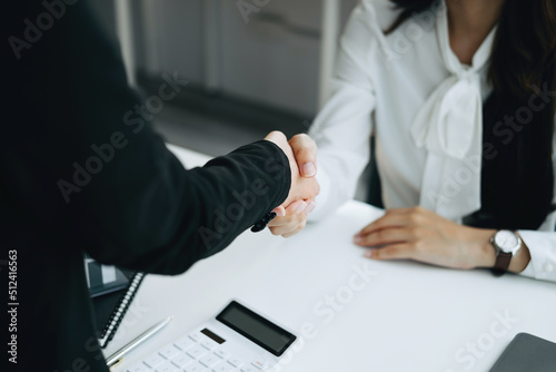Guarantees, Mortgages, Signings, Insurance, contract, agreement concept, Real Estate Agents are shaking hands with customers to congratulate them after landing a deal