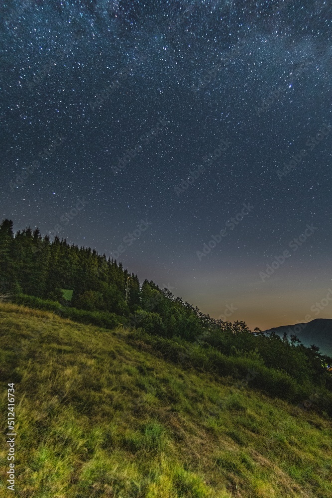Mountain landscape with starry sky and milky way
