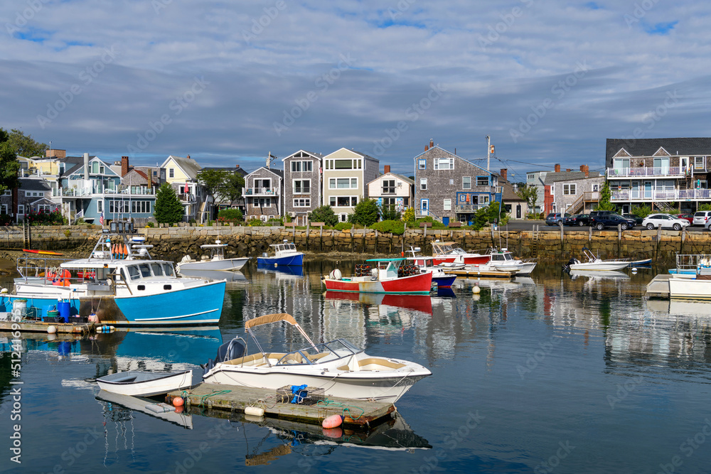 Rockport - A sunny Autumn morning view of colorful fishing boats docking in the peaceful inner harbor of Rockport, a small seaside resort town at tip of Cape Ann, near Boston, Massachusetts, USA.