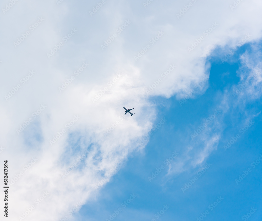 Airplane flying in the sky with white clouds Airplane flying in the sky with white clouds