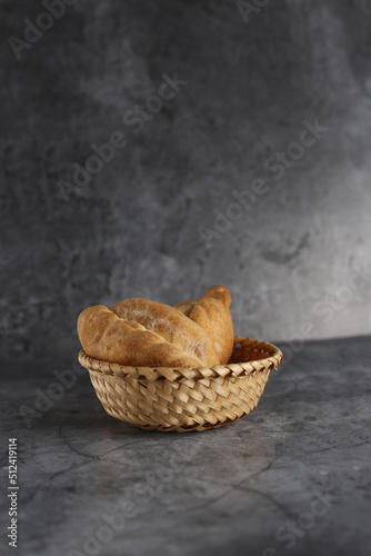 bukens in a wicker basket isolated on gray background