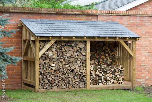 Fototapeta Wood shed store with firewood UK