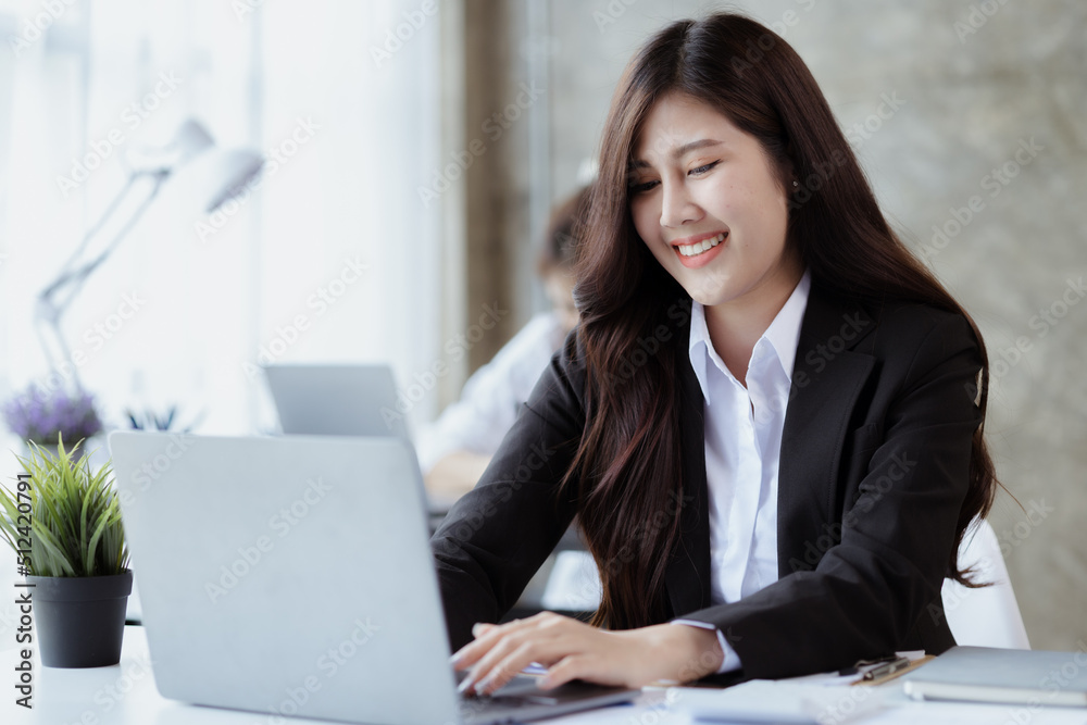 Asian women working in the office, young Asian business women as business executives, founding and running start-up executives, young female business leaders. Startup business concept. Asian women working in the office, young Asian business women as business executives, founding and running start-up executives, young female business leaders. Startup business concept.