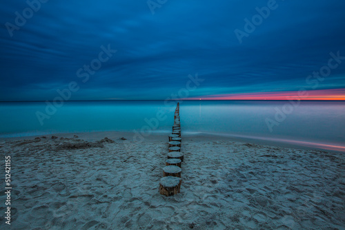 Obraz na płótnie Amazing sunrise over the beach in Chalupy. Seascape with breakwater w salonie