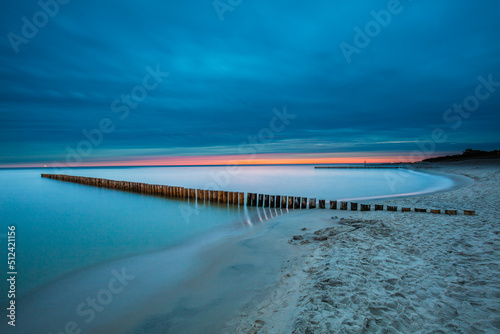 Obraz na płótnie Amazing sunrise over the beach in Chalupy. Seascape with breakwater w salonie