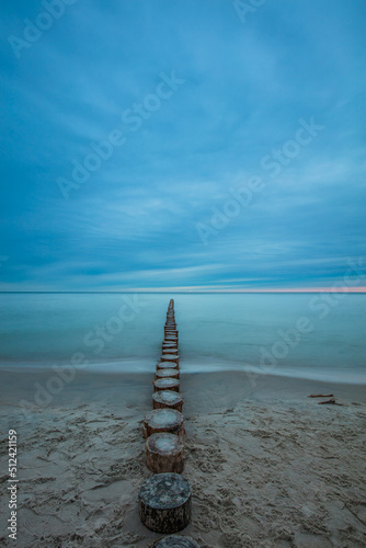 Obraz na płótnie Amazing sunrise over the beach in Chalupy. Seascape with breakwater w salonie