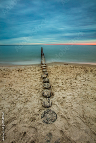Obraz na płótnie Amazing sunrise over the beach in Chalupy. Seascape with breakwater w salonie