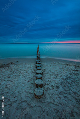 Obraz na płótnie Amazing sunrise over the beach in Chalupy. Seascape with breakwater w salonie