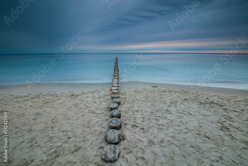 Obraz na płótnie Amazing sunrise over the beach in Chalupy. Seascape with breakwater w salonie