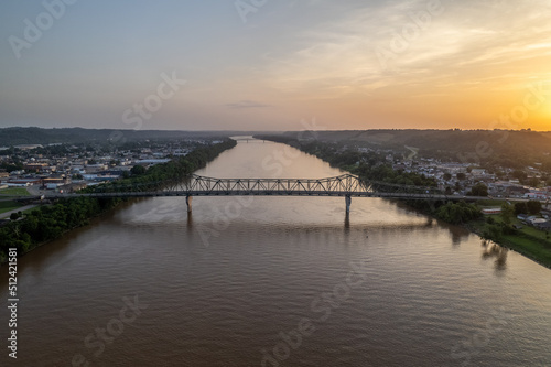 Sun setting Over River and Bridge