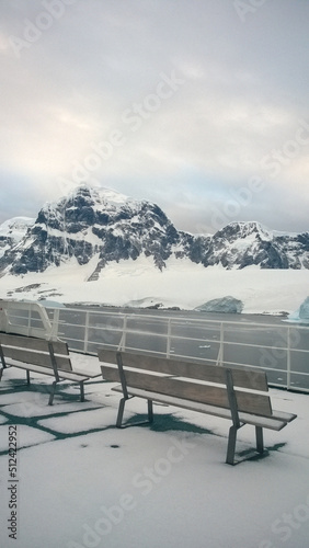 bench aboard a ship in the Antarctic Circle surrounded by the Southern Ocean